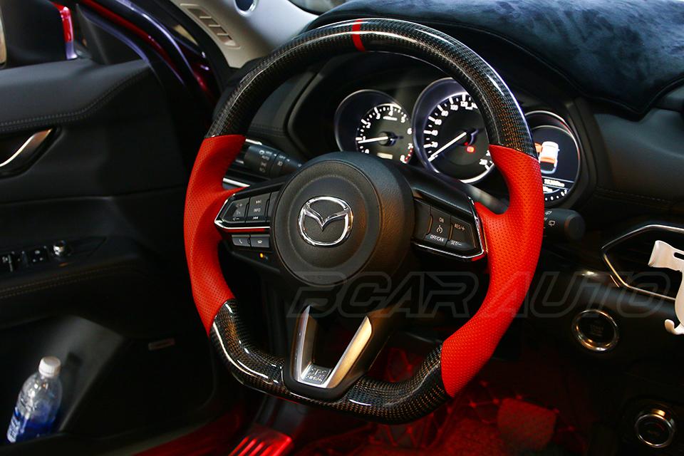 Bọc vô lăng Cacbon xe Mazda